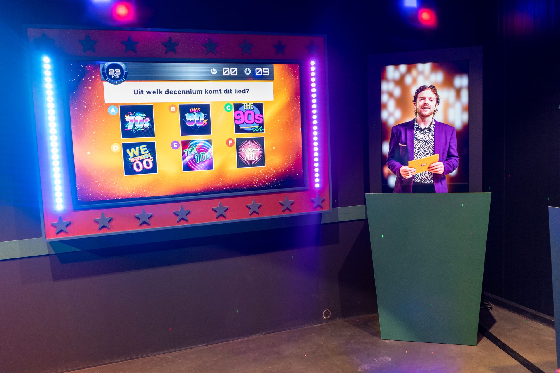 Virtual host presenting a quiz show on the QuizX Arena screen