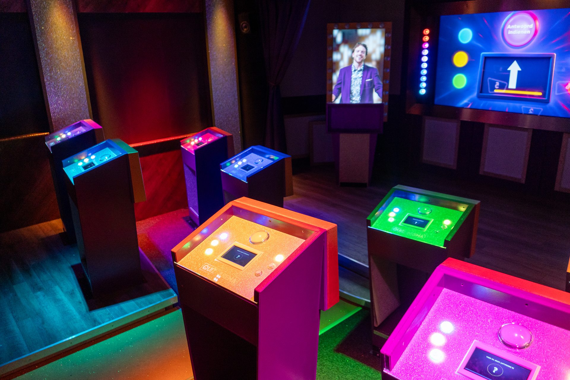 Teams playing in the illuminated QuizX Arena