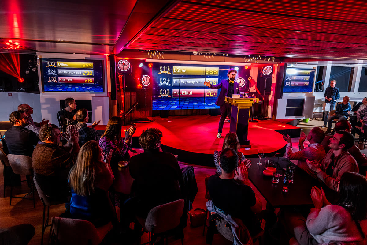 Corporate quiz show scoreboard finale on a cruise ship