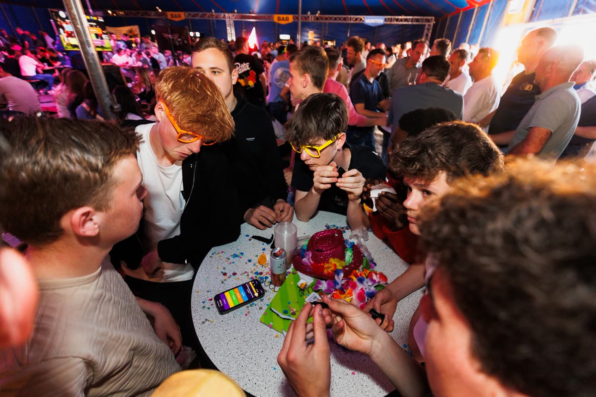 Team answering quiz questions in a festival tent