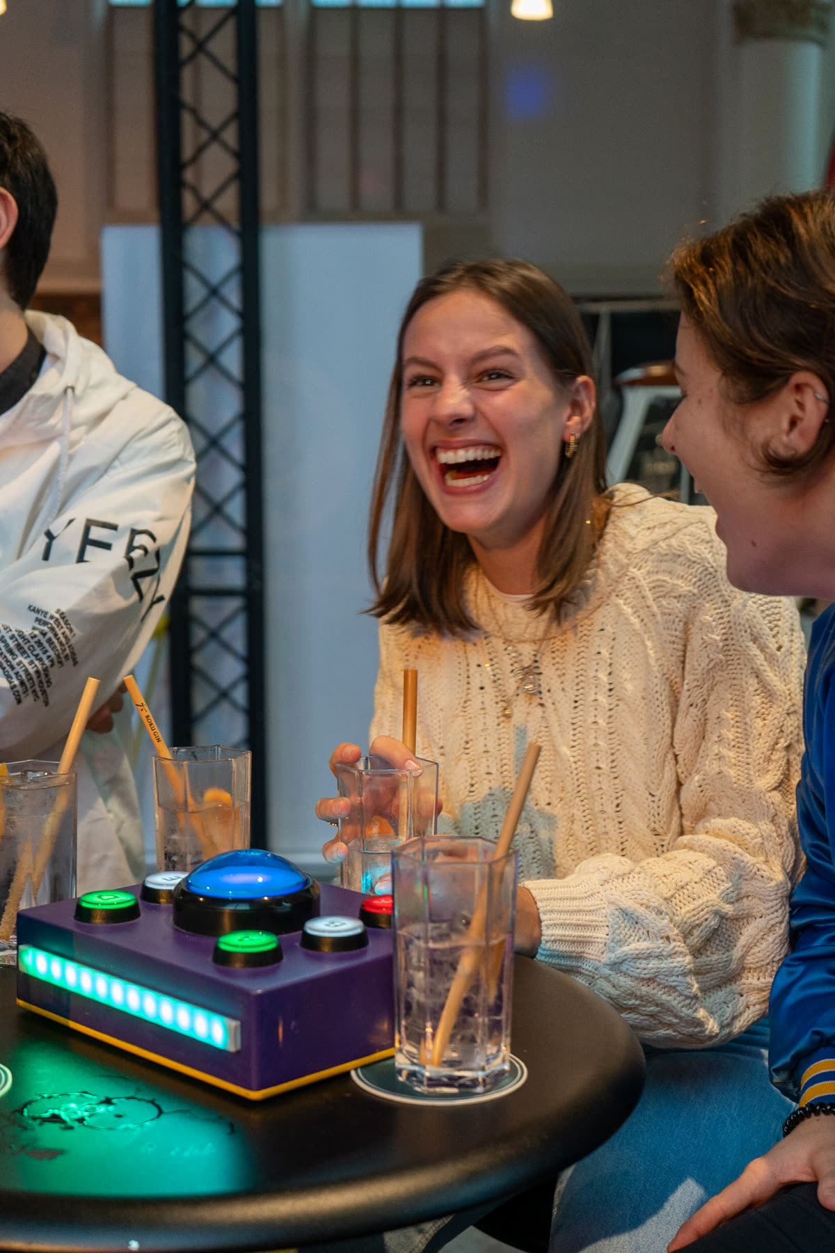Player laughing with a QuizX buzzer box
